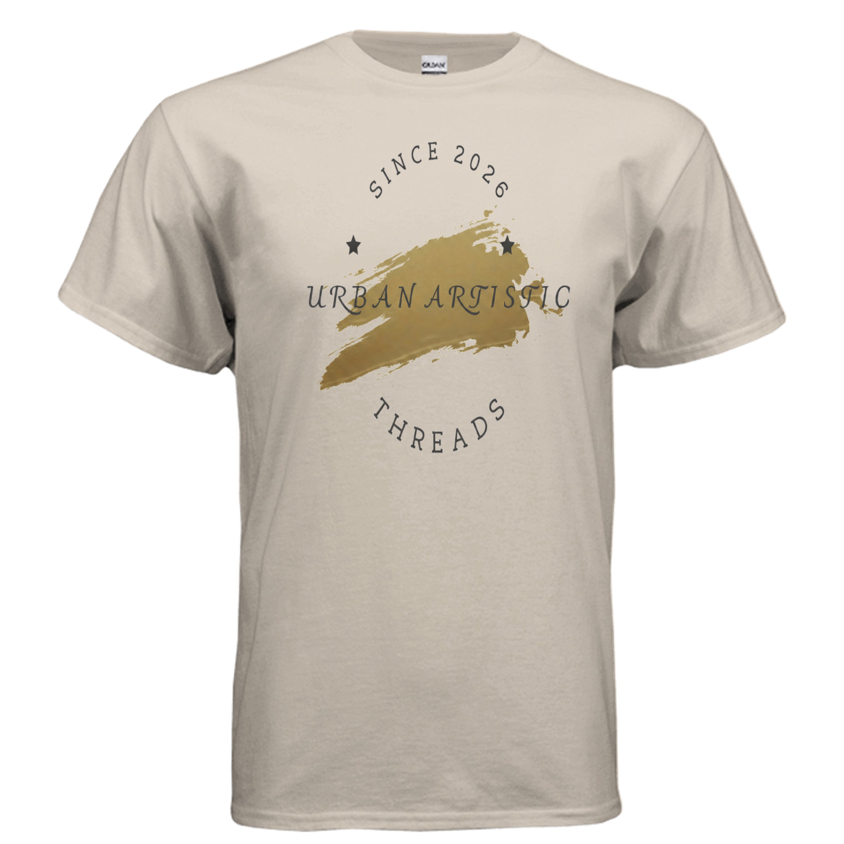 Urban Artistic Signature Tee on beige fabric with a gold paint-stroke logo and circular Urban Artistic Threads text