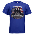 Blue T-shirt featuring I Stand With Epstein Survivors design with silhouetted figures against a distressed American flag