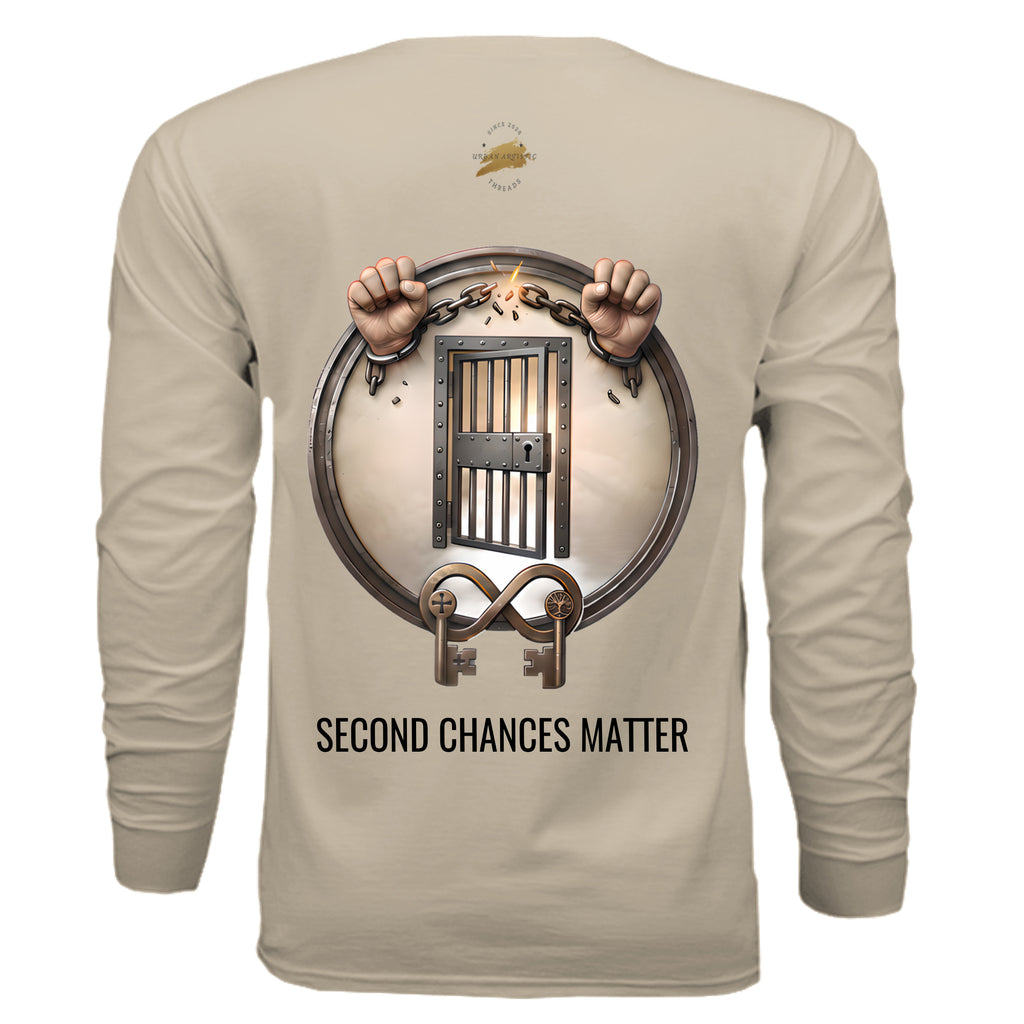Beige long-sleeve tee with circular jail graphic: breaking chains and open door, captioned Second Chances Matter.