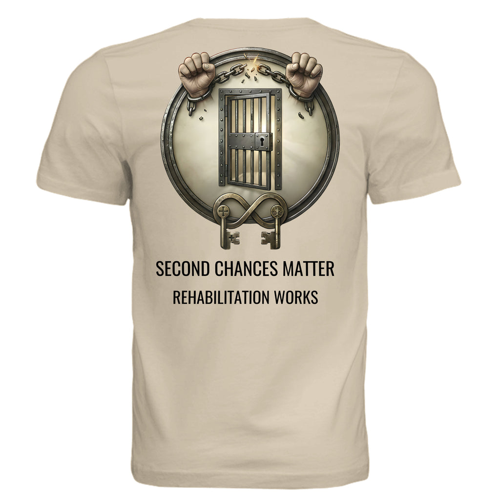 Rehabilitation Works graphic tee featuring a circular jail-door emblem with chained hands and Second Chances Matter text.