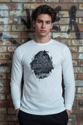 White long sleeve tee featuring black Urban Vandal Defiance On Deck skate graphic against a graffiti brick wall.