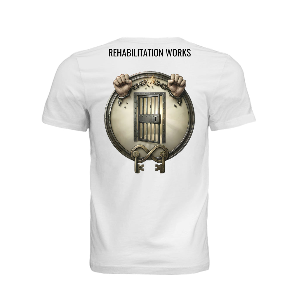 White unisex t-shirt featuring Rehabilitation Works graphic with hands breaking chains, prison bars, and keys symbolizing second chances.