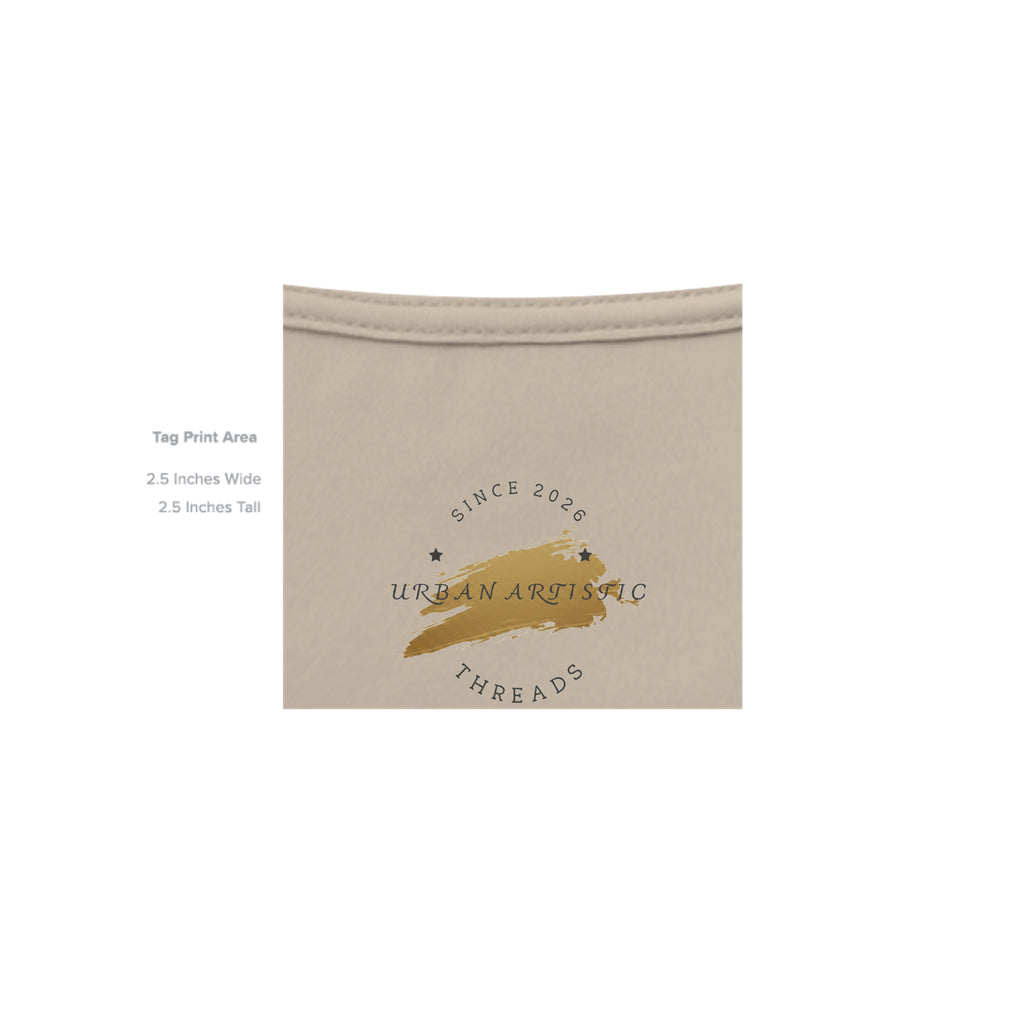 Urban Artistic Threads tag print area showing gold brushstroke logo on beige unisex graphic tee collar.